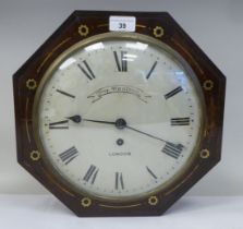 A 19thC brass inlaid mahogany cased octagonal wall timepiece; the fusee pendulum movement faced by a