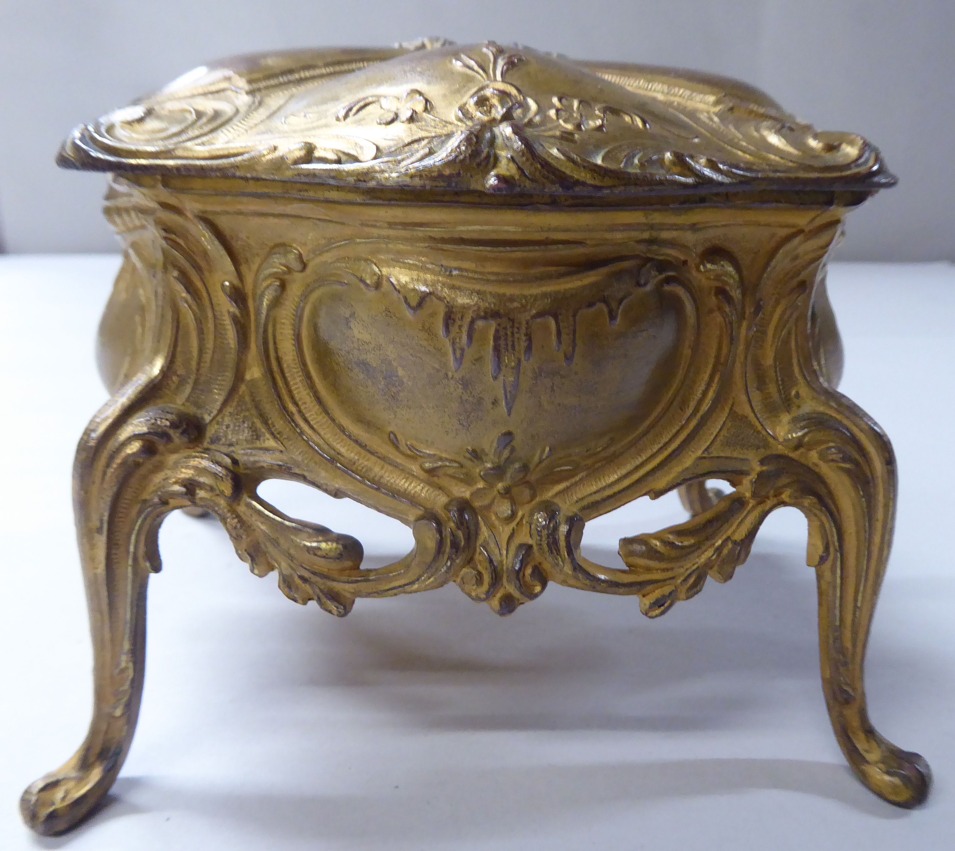 A late 19thC cast gilded metal jewellery box, fashioned as a commode, the hinged lid enclosing a - Image 2 of 10