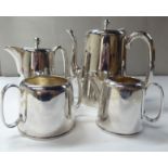 A four piece EPNS coffee set of tapered form, comprising a coffee pot, hot water pot, twin handled