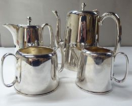 A four piece EPNS coffee set of tapered form, comprising a coffee pot, hot water pot, twin handled