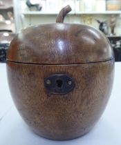 An early 19thC fruitwood tea caddy, fashioned as an apple with a hinged lid  5.5"h