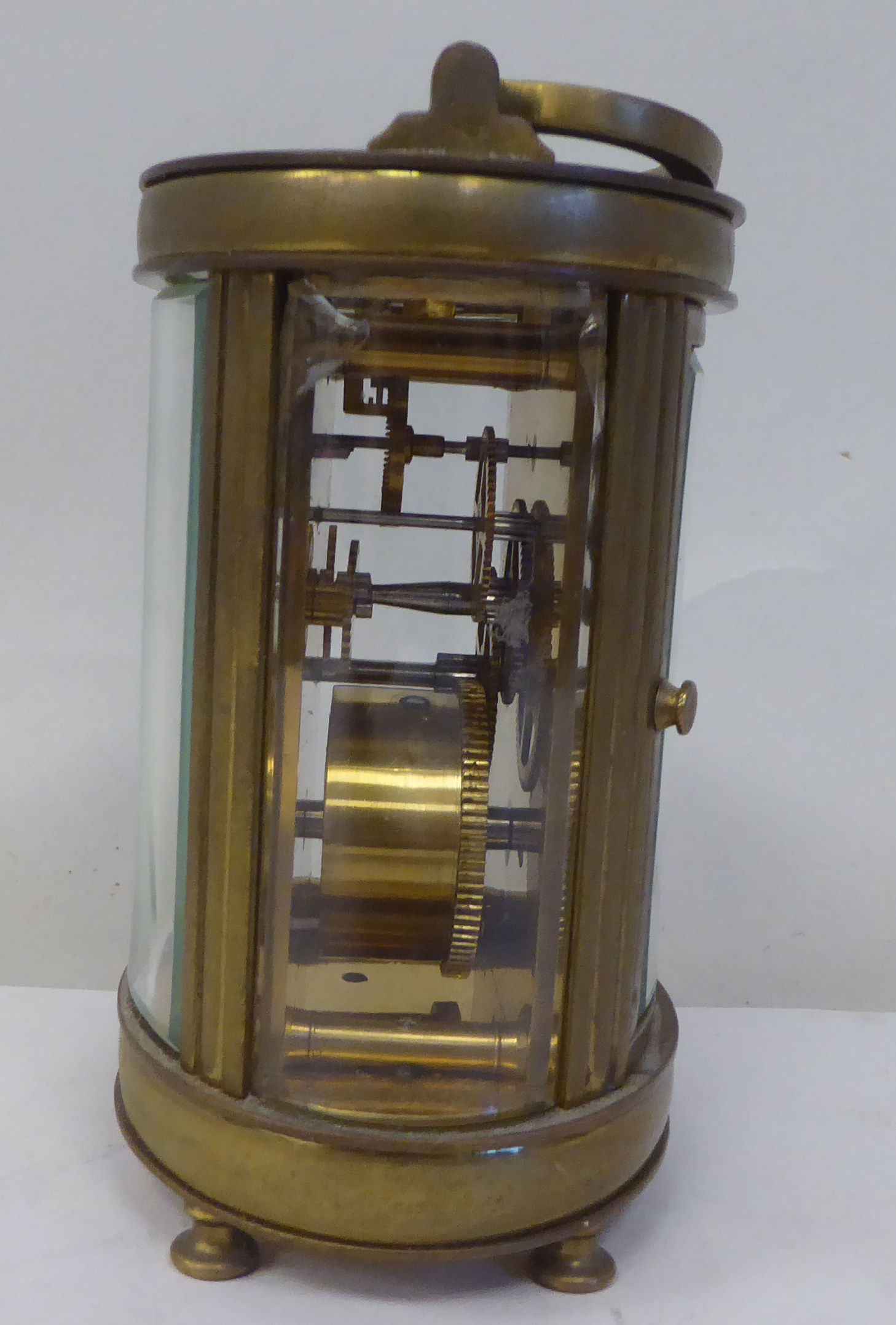 An early 20thC French oval brass cased carriage timepiece with bevelled glass panels and a folding - Image 2 of 11