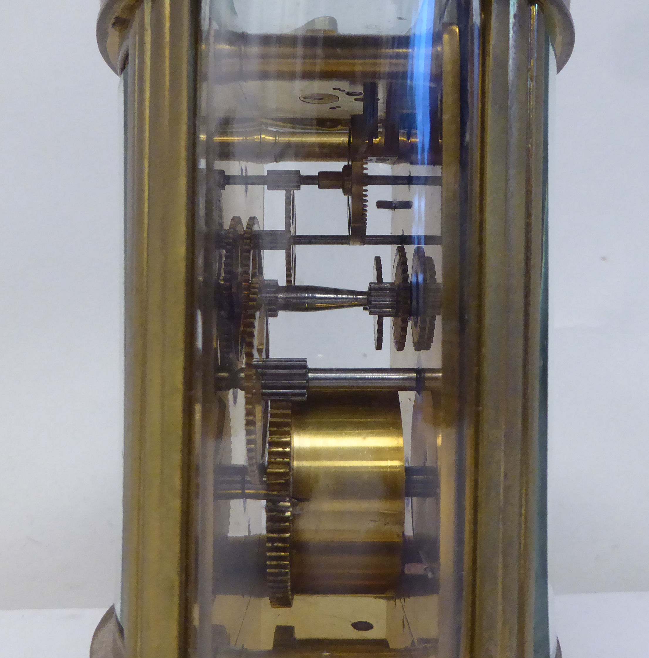 An early 20thC French oval brass cased carriage timepiece with bevelled glass panels and a folding - Image 9 of 11