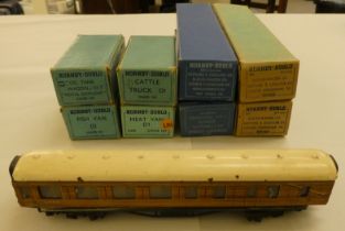 Four Hornby 00 gauge tinplate passenger coaches  boxed; another unboxed example; and four goods