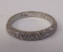 An 18ct white gold and diamond set half-eternity ring