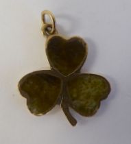 A 9ct gold hardstone set pendant, fashioned as a three leaf clover