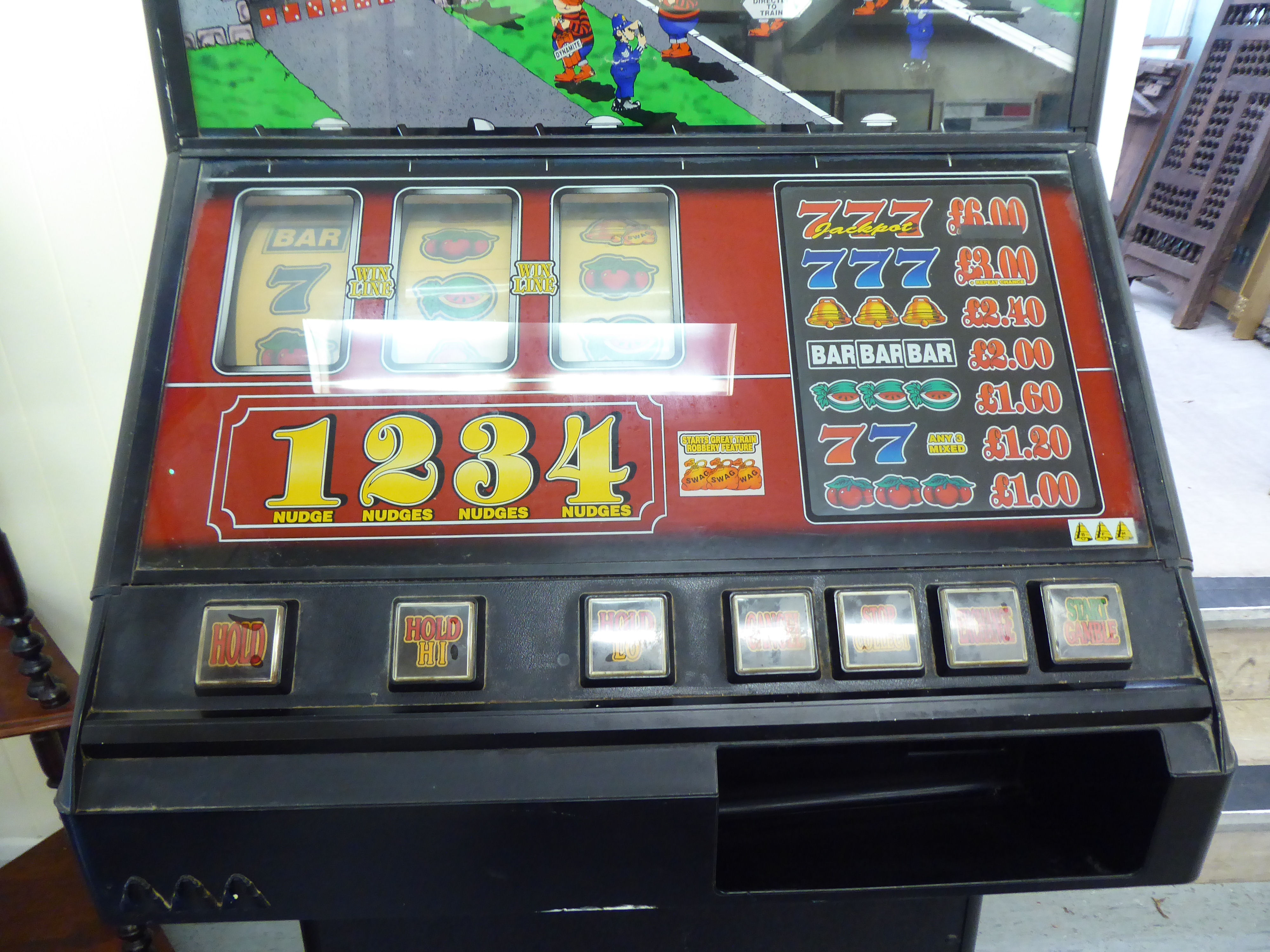 A circa 1980s pub electrically powered 'Great Train Robbery' themed fruit machine  66"h  25"w  (sold - Image 3 of 8