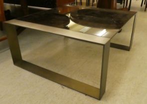 A modern burnished bronze coloured, steel framed coffee table with smoked glass top  17"h  36"sq