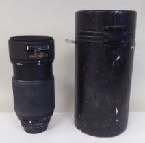 A Nikon AF Nikkor 80-200mm 1:2.8 photographic lens  cased