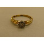 An 18ct gold claw set diamond solitaire ring