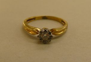 An 18ct gold claw set diamond solitaire ring