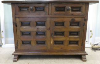 A modern traditional Old English style oak sideboard with two frieze drawers, over two panelled