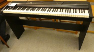 A Korg model no. SP-1705 electric piano  29"h  52"w