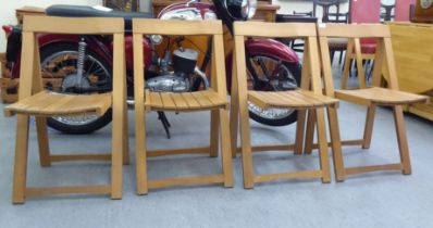 A set of four modern folding beech framed chairs