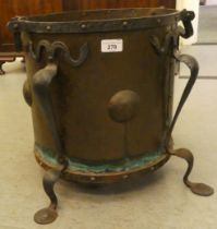 An Arts & Crafts period cast and wrought iron bound, rivetted copper coal bin, raised on splayed