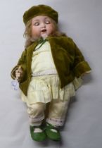 An early 20thC Armand Marseille 990 bisque head doll with painted features, on a jointed composition