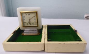 An Art Deco Smith's alarm travel timepiece, faced by an Arabic dial  5"h  boxed