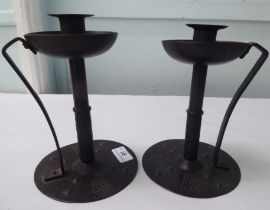 A pair of Arts & Crafts inspired, cast iron candlesticks  stamped Gorers  7"h