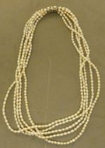 A freshwater pearl necklace, consisting of five strands, connected by a white metal clasp  stamped