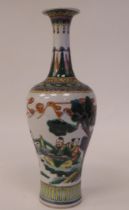 A late 19thC Chinese vase of baluster form, decorated with figures in a garden setting  10"h