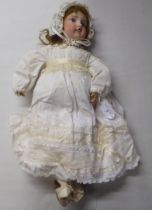 An early 20thC Verlingue Petite Francais bisque head doll with painted features, on a jointed