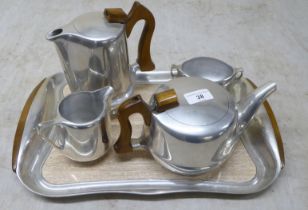 A five piece Picquot Ware tea set, comprising a tray  17"w, teapot, coffee pot, cream jug and a