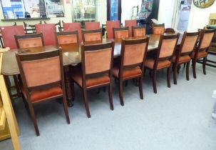 A late Victorian oak dining table, the top with  thumb moulded edge, raised on turned, tapered