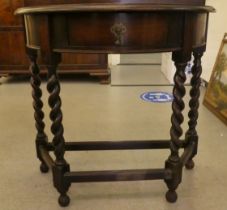 A 1930s oak demi-lune single drawer side table, raised on barleytwist legs  34"h  30"w