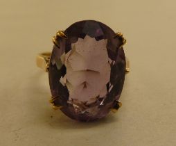 A 9ct gold ring, set with a light purple coloured stone