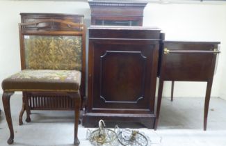 Small 20thC furniture: to include an oak framed 1920s embroidered panel firescreen  34"h  22"w