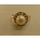 A yellow metal pearl and diamond set cluster ring