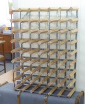A mixed lot: to include a pine and metal wine rack with provision for 48 bottles  32" x 25"