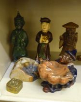 Oriental wooden, pottery and stone models: to include a seated figure holding a shell  6"h