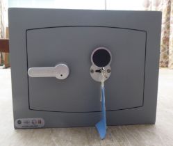 A Mini Vault floor safe  12"h  15"w  13"deep with one key