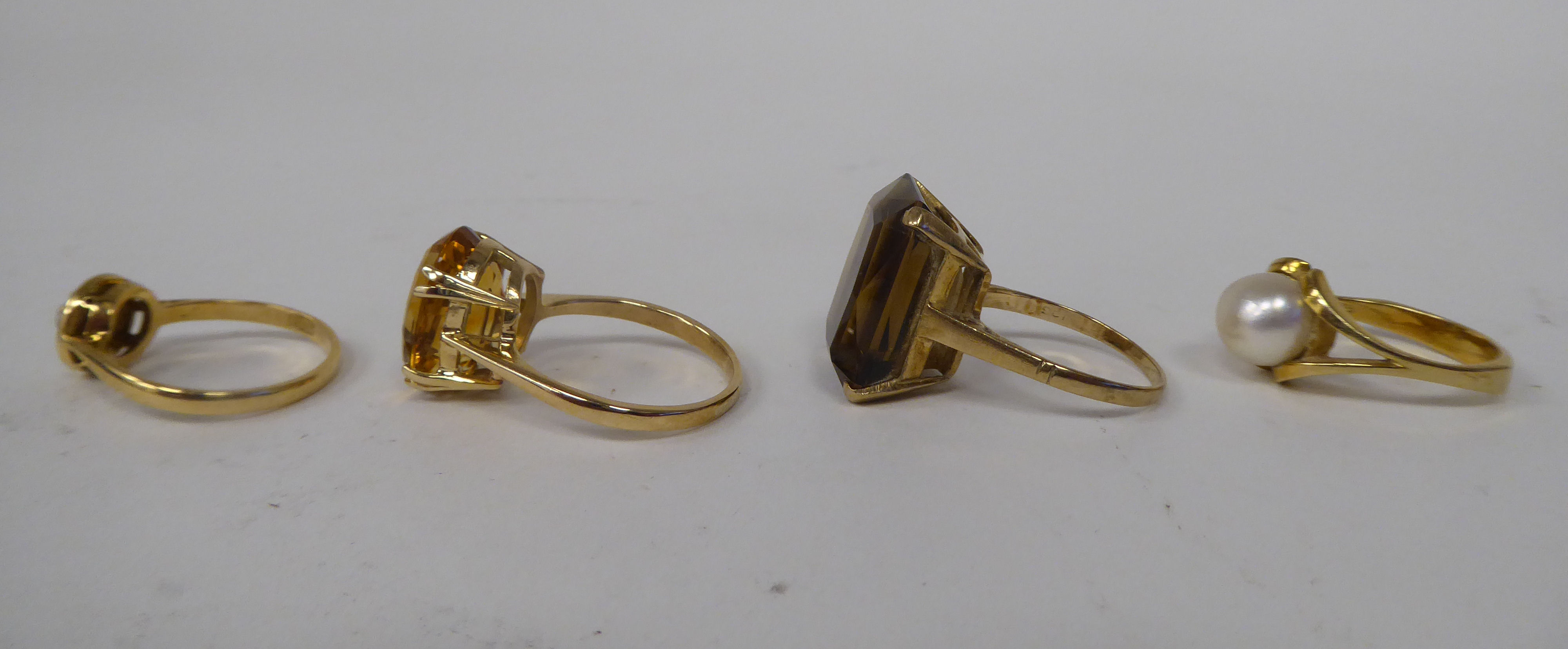Four various 9ct gold and other dress rings, one claw set with a citrine - Image 2 of 3