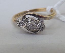 A 9ct gold three stone diamond ring