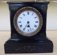 A late Victorian black marble cased mantel timepiece; faced by a Roman dial, on a plinth  10"h  9"w