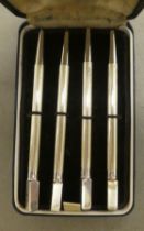 A set of four engine turned, Sterling silver bridge pencils  cased