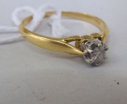 An 18ct gold diamond solitaire ring