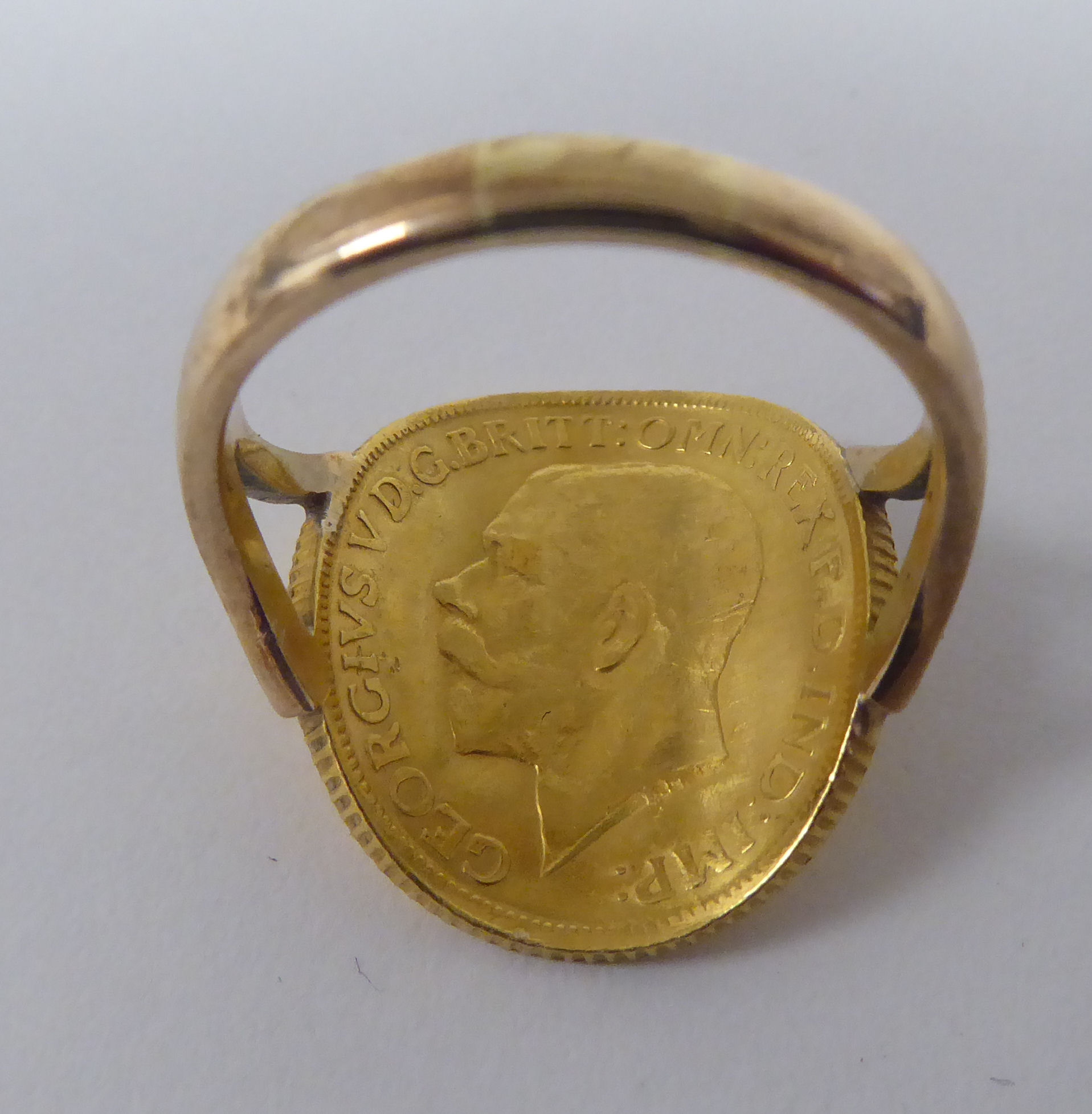 A gold coloured metal signet ring, incorporating a George V sovereign, St George on the obverse - Image 2 of 4