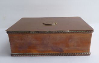A copper cigarette box with straight sides and a hinged lid, bearing a presentation inscription to
