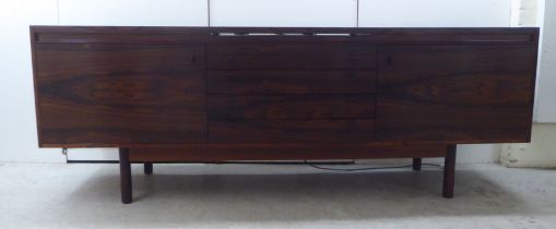Attributed to Robert Heritage for Archie Shine, a 1960s rosewood sideboard, the top with a rising