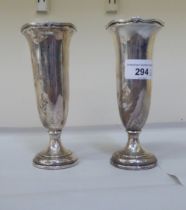 A pair of loaded silver pedestal vases  Birmingham 1942  6"h