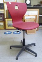 A Verner Panton red plastic, height adjustable, rotating desk chair, model no. 09-406, on a