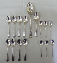 Silver flatware: to include a set of six bright cut engraved teaspoons; and four seal end terminal