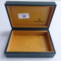 A hinged Rolex watch box