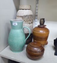 A mixed lot: to include two similar mixed hardwood table lamps  approx. 9"h; and a Poole Pottery