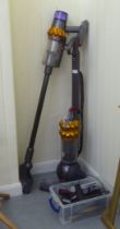 Two Dyson vacuum cleaners: to include a DC50; and a V15