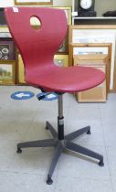 A Verner Panton red plastic, height adjustable, rotating desk chair, model no. 09-406, on a