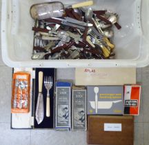 Mainly 1970/80s retro design teak and other handled cutlery and flatware